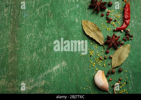 Assorted spices on wooden background Stock Photo