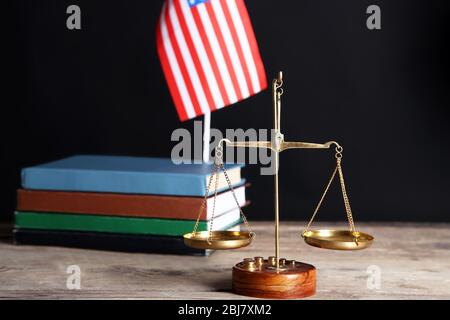 Justice scales with USA flag and books on black background Stock Photo