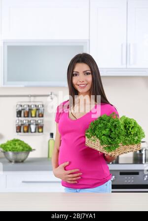 pregnant young woman with a basket of fruit Stock Photo - Alamy