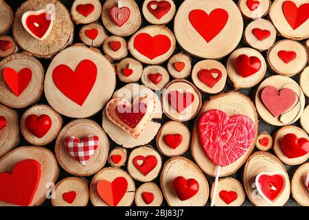 Valentine's Day concept. Different colourful hearts on wooden stumps background Stock Photo