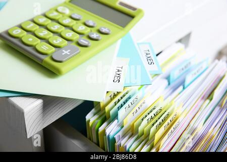 Folders with tax documents and calculator Stock Photo