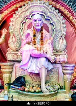 Indian Hindu God Shirdiwale Sai Baba Blessing Stone idol in Hindu Spiritual temple, Regarded by his Devotees as a Saint. Stock Photo