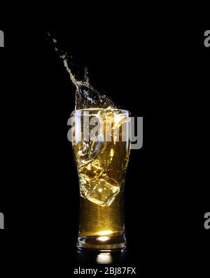 Glass of beer on black background Stock Photo