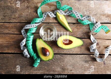 Fresh avocados  on wooden table, top view Stock Photo