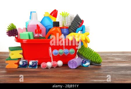 Basin of cleaning supplies on the floor Stock Photo