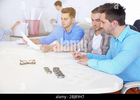 Engineers and bearings on table Stock Photo