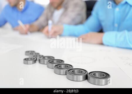 Engineers and bearings on table, closeup Stock Photo