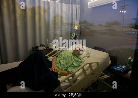 Porterville, United States. 27th Apr, 2020. Jerry Hogan, a Vietnam Veteran, lies on a bed at Lindsey Gardens after testing positive for COVID-19/Coronavirus, a week earlier Hogan had been in the hospital, where he had pneumonia unrelated to Coronavirus, and had tested negative, when he was sent to a skilled nursing facility for rehabilitation, then there was an outbreak at the facility where he then tested positive a few days later. Credit: SOPA Images Limited/Alamy Live News Stock Photo