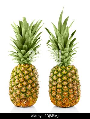 Two ripe fresh pineapples, isolated on white Stock Photo