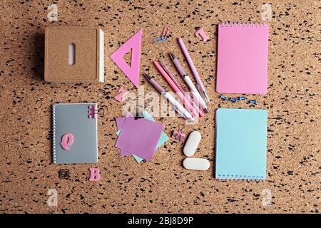 Stationery on cork desk background Stock Photo
