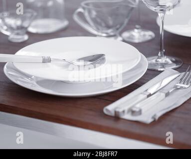 Table setting with plates and cutlery Stock Photo
