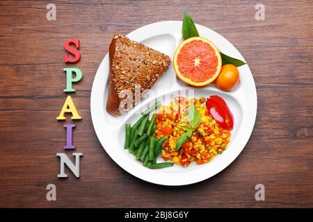 Traditional Spanish lunch on wooden background Stock Photo