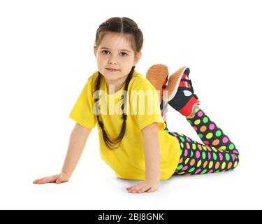 Little cute girl practicing yoga pose, isolated on white :: Stock