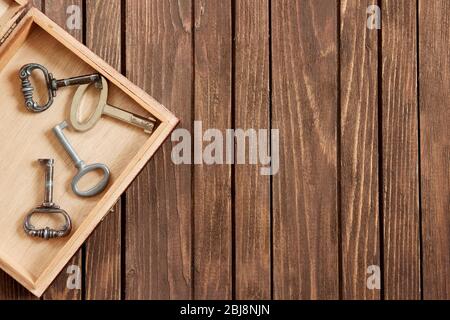 Vintage keys in a wooden box. Stock Photo