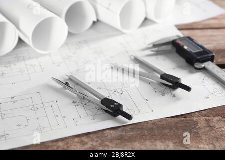 Set of engineering drawings with tools on wooden table closeup Stock Photo