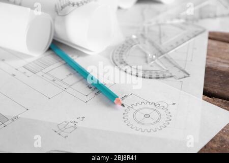 Set of engineering drawings with tools on wooden table closeup Stock Photo