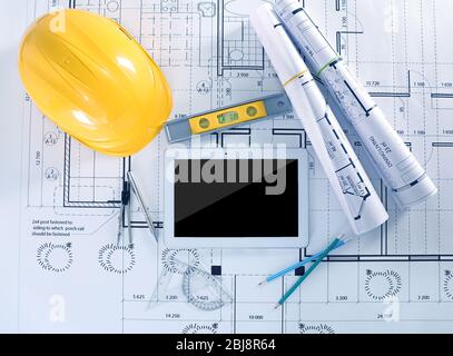 Construction blueprints with tools and tablet, top view Stock Photo