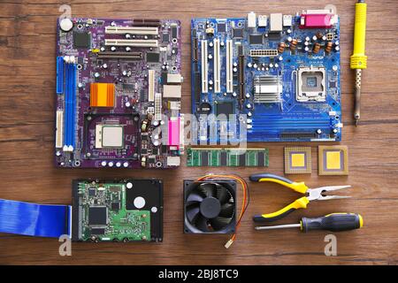 Electronic circuits on wooden table, top view Stock Photo