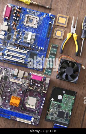 Electronic circuits on wooden table, top view Stock Photo