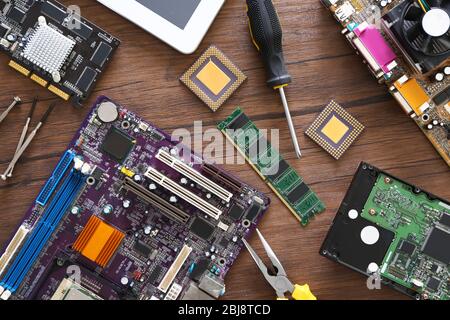 Electronic circuits on wooden table, top view Stock Photo