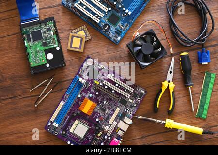 Electronic circuits on wooden table, top view Stock Photo
