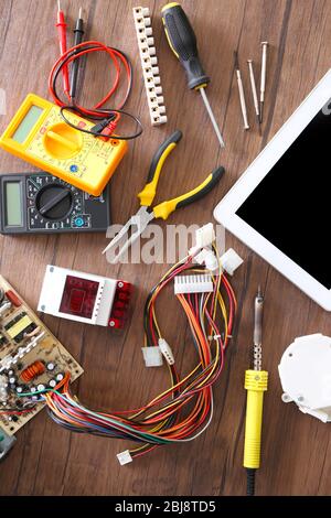 Different electrical tools on wooden table, top view Stock Photo