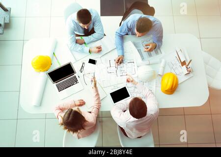 Young engineers working in the office, top view Stock Photo