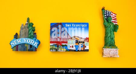 USA with magnets from new york and san francisco on yellow background, travel destination Stock Photo