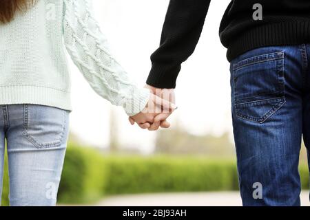 Loving couple holding hands Stock Photo