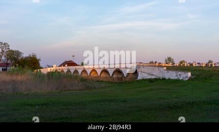 The famous nine hole bridge at sunset Hortobagy, Hungary Stock Photo