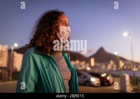 Caucasian woman wearing a protective mask against coronavirus Stock Photo
