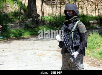 Anantnag, India. 28th Apr, 2020. Security personnel sealed the red zone area of Aswora Kanalwan of South Kashmir's Anantnag district after one coronavirus positive case detected in the area. (Photo by Aasif Shafi /Pacific Press) Credit: Pacific Press Agency/Alamy Live News Stock Photo