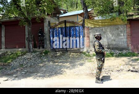 Anantnag, India. 28th Apr, 2020. Security personnel sealed the red zone area of Aswora Kanalwan of South Kashmir's Anantnag district after one coronavirus positive case detected in the area. (Photo by Aasif Shafi /Pacific Press) Credit: Pacific Press Agency/Alamy Live News Stock Photo