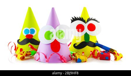 Funny party hats with blowers on a white background Stock Photo - Alamy