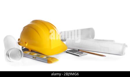 Construction drawings with tools and helmet isolated on white Stock Photo