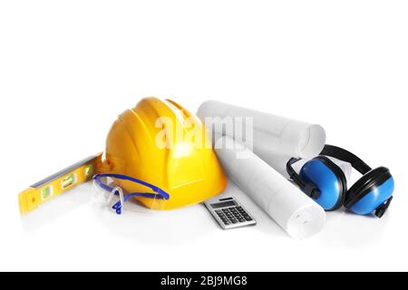 Construction drawings with tools and helmet isolated on white Stock Photo