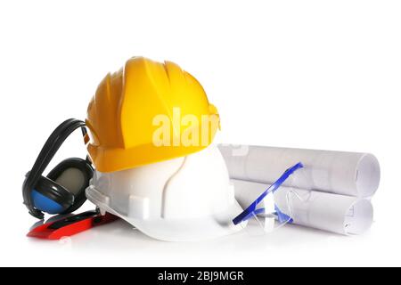 Construction drawings with tools and helmets closeup Stock Photo