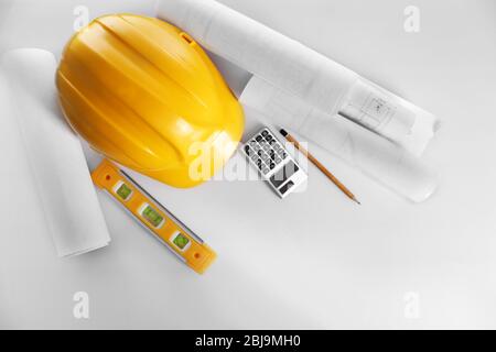 Construction drawings with tools and helmet, top view Stock Photo