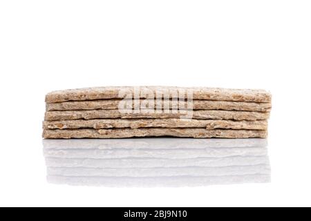 Stack of grain crisp bread isolated on a white background. Stock Photo