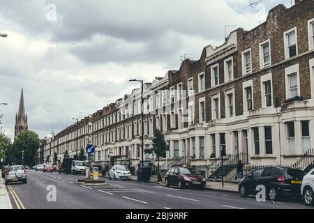 London/UK-30/07/18: a row of typical British Georgian terrace houses. Terrace house is a form of medium-density housing that originated in Europe, whe Stock Photo