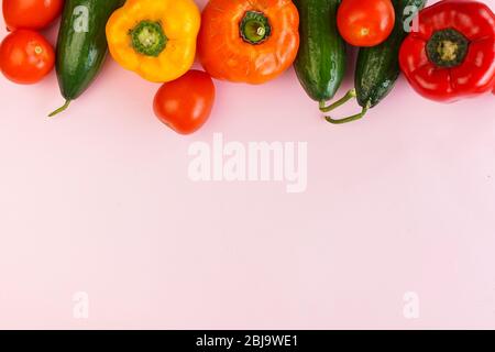 selective focus, colored vegetables, proper nutrition concept, copyspace on a pink background Stock Photo