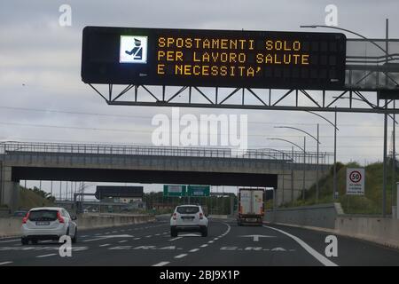 Rome, Italy - April 28, 2020: A message inviting you not to leave home during the Covid-19 coronavirus emergency on a display of the A24 motorway Stock Photo