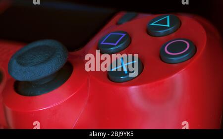 Photo of a red wireless video game controller Stock Photo
