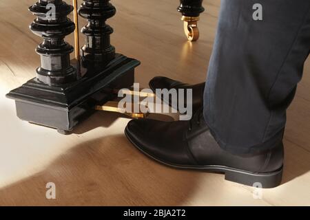 Man feet while playing piano Stock Photo