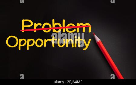 Problems crossed out and opportunity on blackboard. Everything is possible concept, crisis management concept Stock Photo