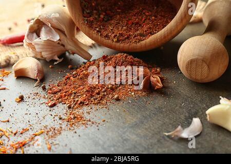 Different spices on gray background Stock Photo