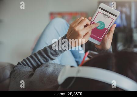 Online shopping and modern lifestyle concept: young woman shopping online at home. Stock Photo