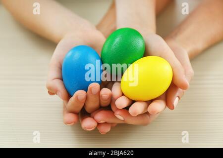 Mother and daughter holding Easter eggs Stock Photo