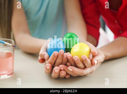 Mother and daughter holding Easter eggs Stock Photo