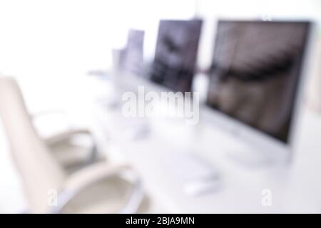 Blurred office background with computers Stock Photo